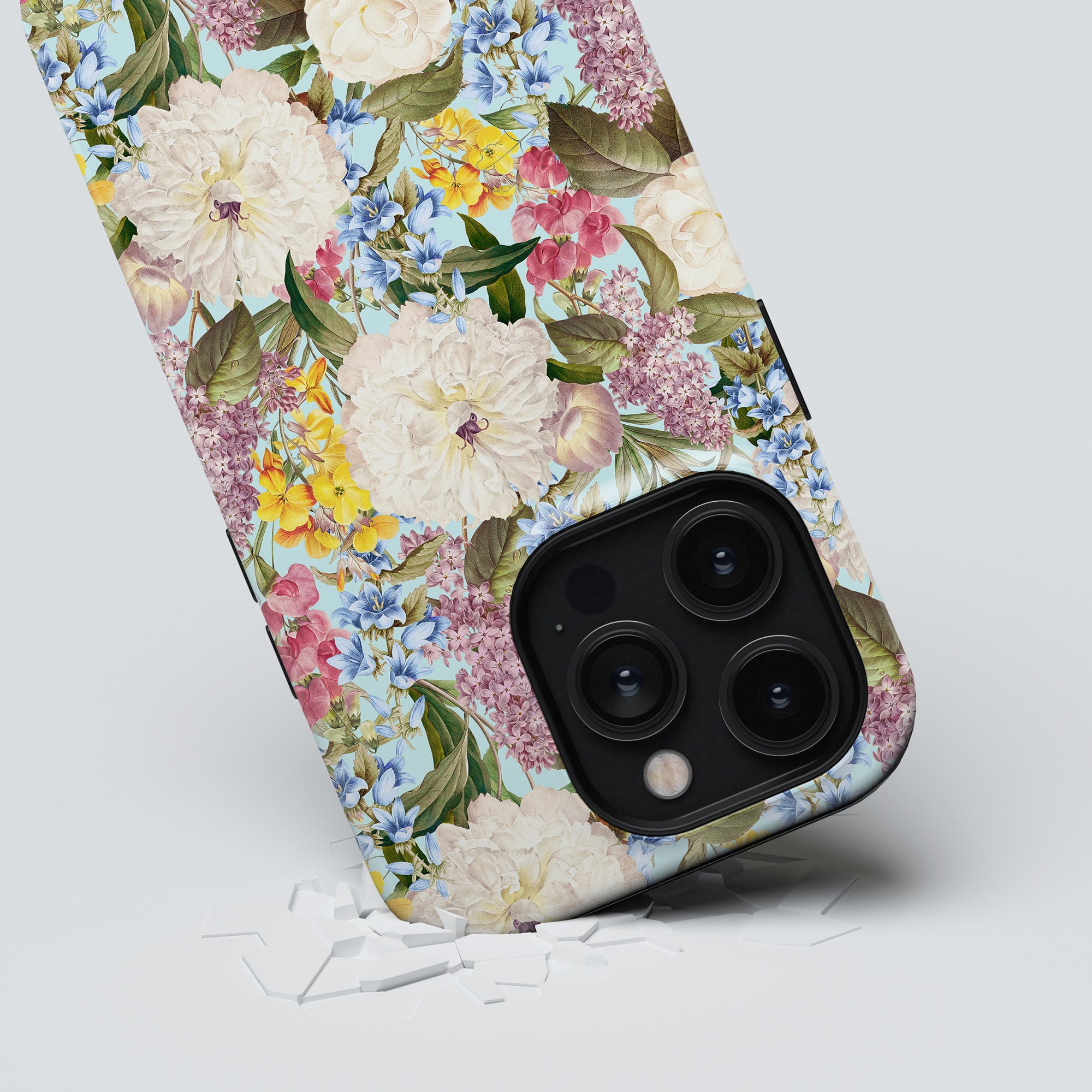 Fragrant Paradise - Tough Case with a stylish floral case partially submerged in a white surface.