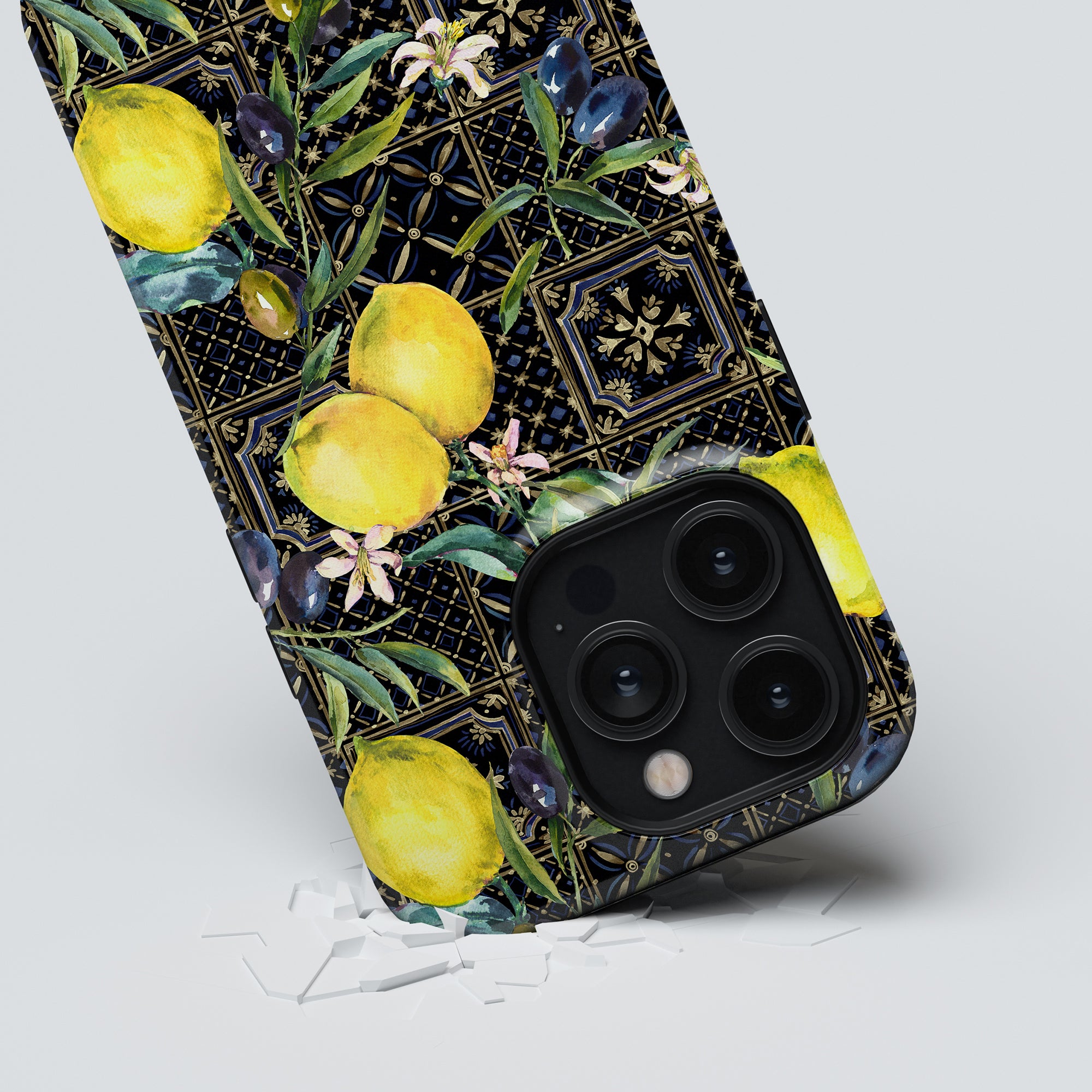 Sorrento - Tough Case with a floral and lemon patterned case made of eco-friendly materials breaking through a surface.
