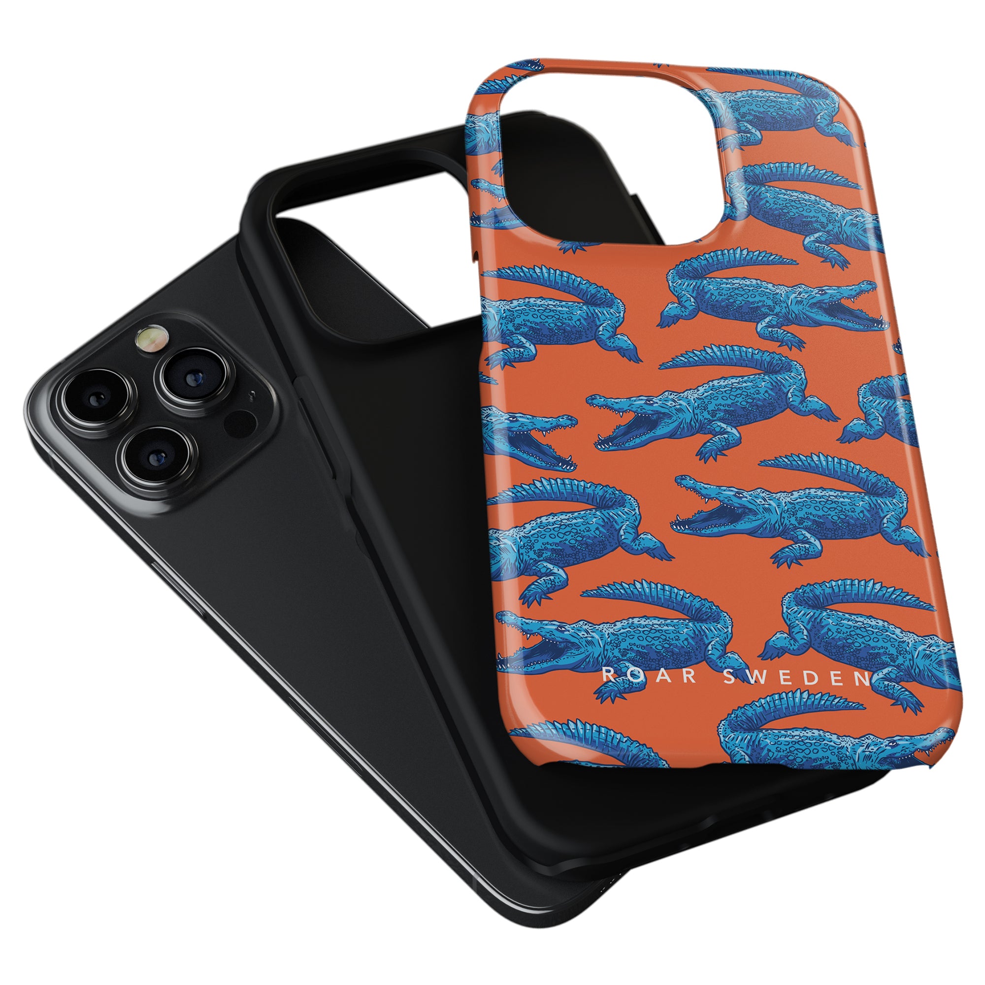 Two smartphone cases from Roar Sweden: one is plain black, and the other is the Groovy Croc - Tough case featuring vibrant orange with blue alligator illustrations.