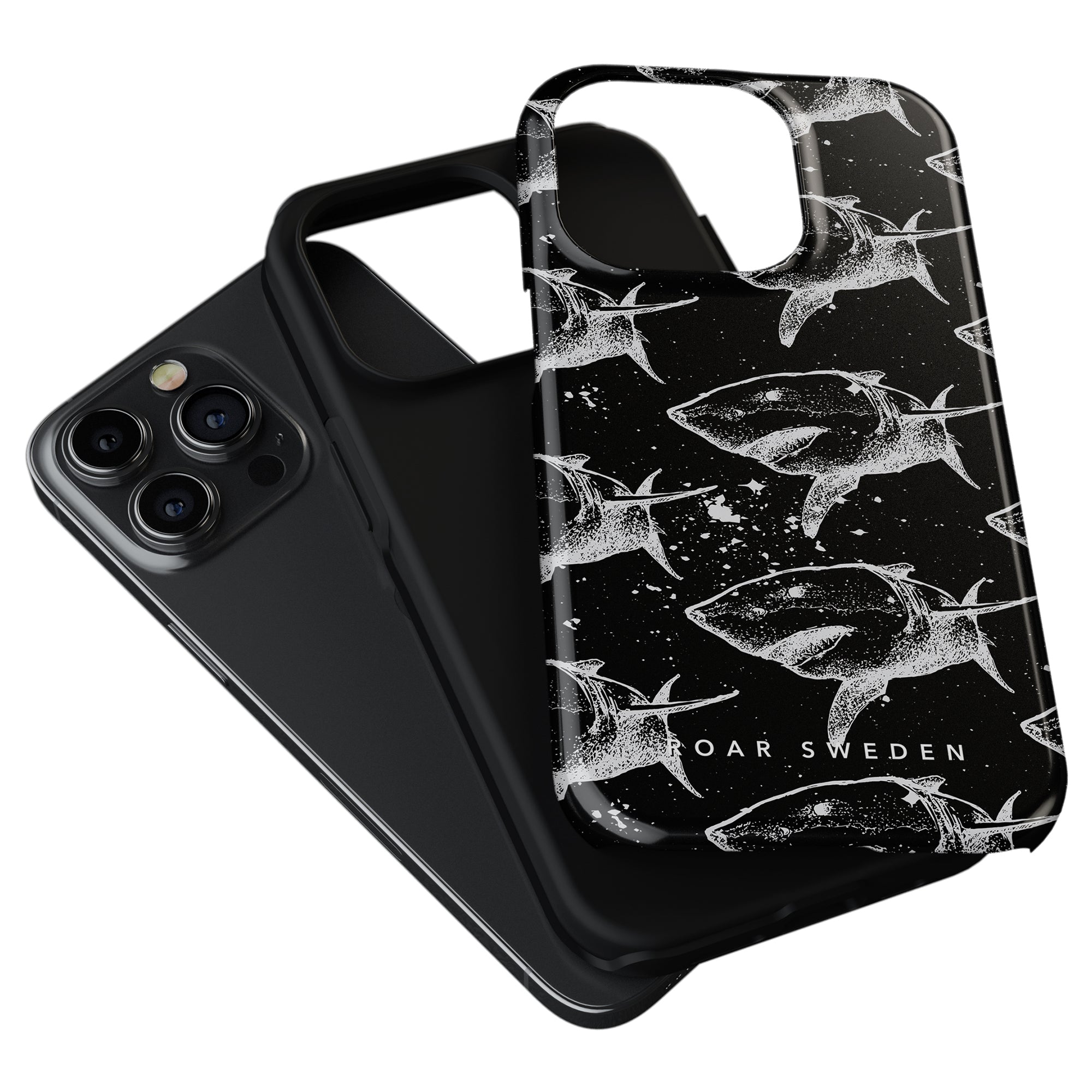 Two black Shark Attack tough cases designed for maximal skydd. One is plain, while the other features white whale patterns and the text "ROAR SWEDEN." Perfect for those seeking a tough case with style.